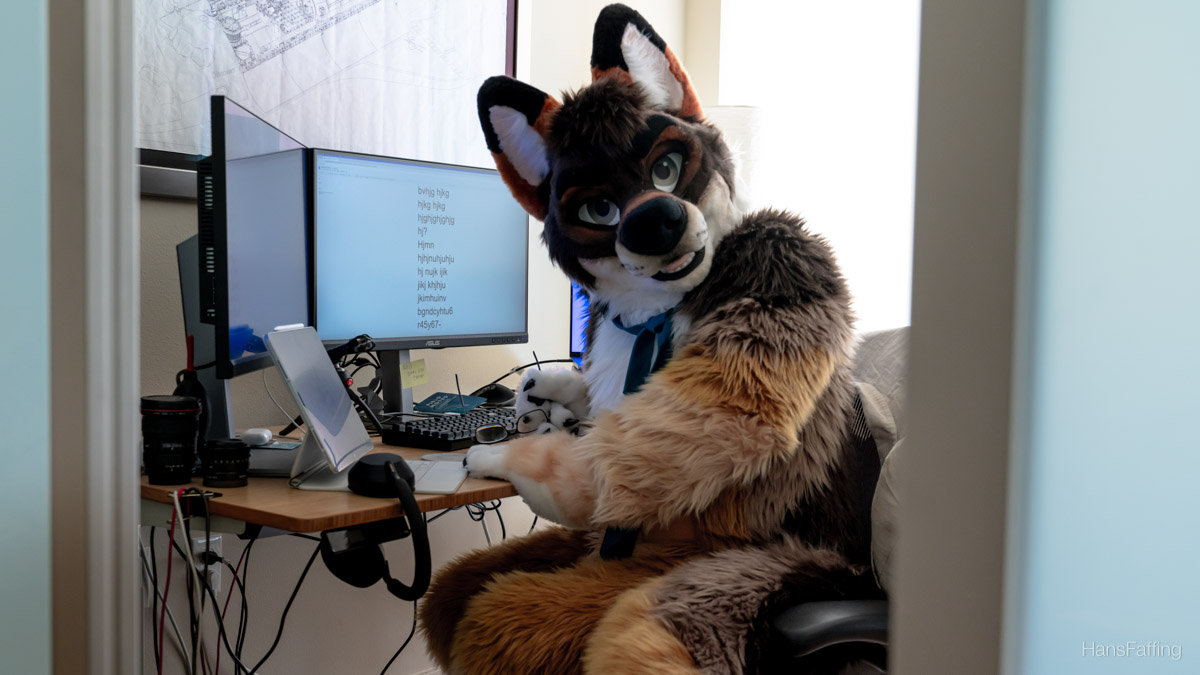 Hans notices you are watching him work and looks at you